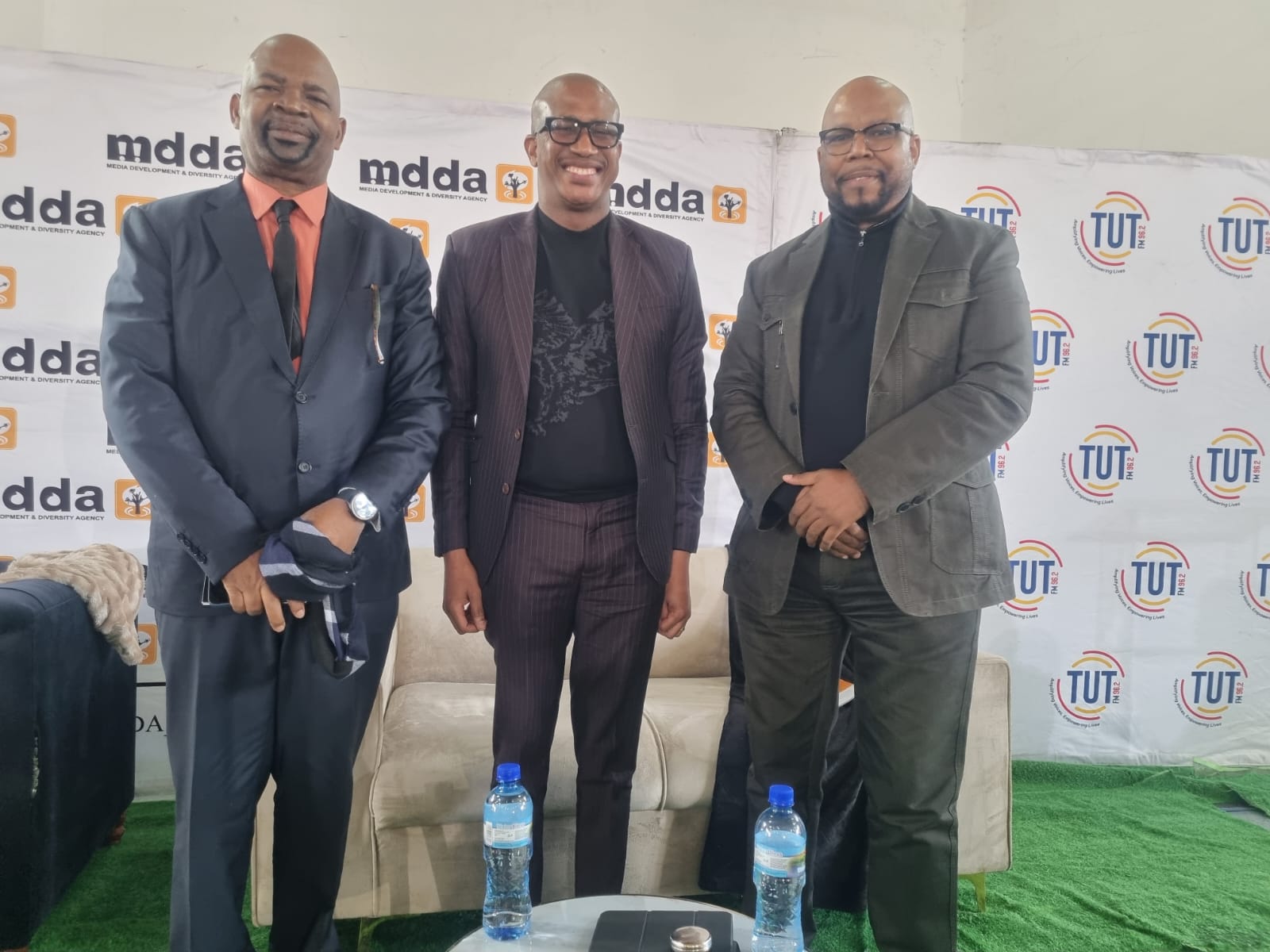 Deputy Minister in the Presidency Kenny Morolong (centre),MDDA board member Phil Moiloa (right), and Vice-Chancellor and TUT Principal, Professor Tinyiko Maluleke cut the ribbon to officially open both campuses' studios.
